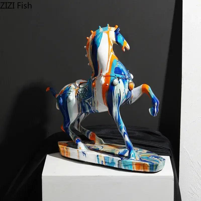 Vibrant blue white and orange abstractly painted ceramic horse sculpture with decorative saddle from decorbites animal resin statue collection