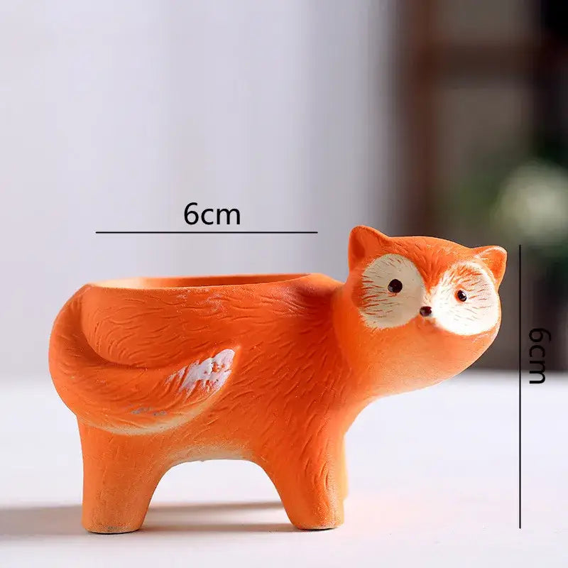Orange ceramic fox-shaped animal vase succulent pot with white accents for garden decor by DecorBites™