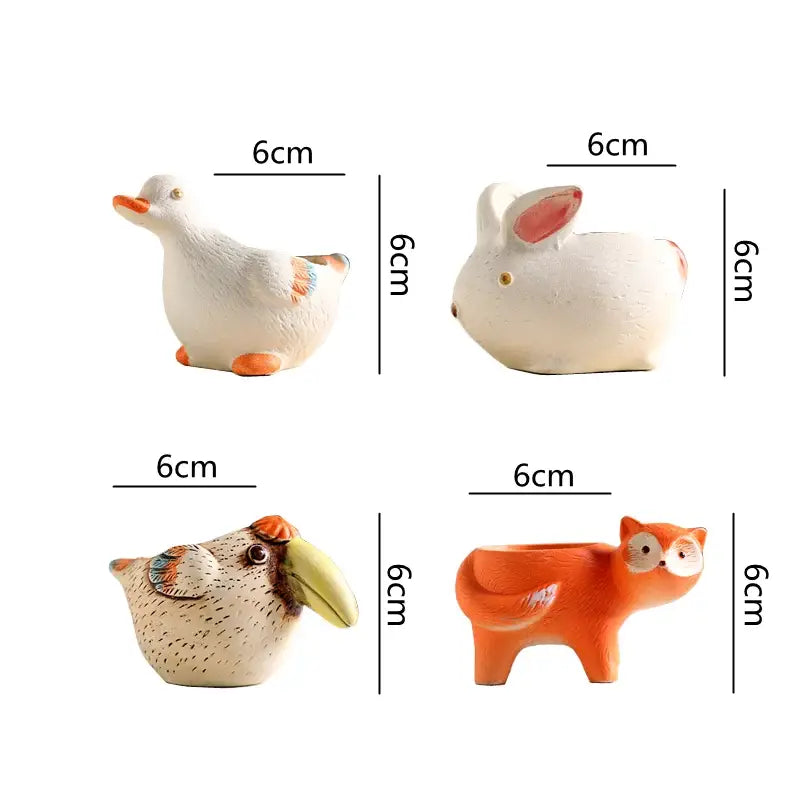 Set of four 6cm ceramic animal vase succulent pots featuring painted duck rabbit toucan and fox designs by DecorBites