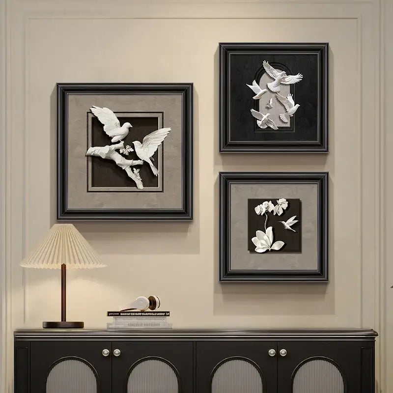 Three framed decorbites™ animal wall decor frame set with white sculpted birds and floral motifs on dark backgrounds