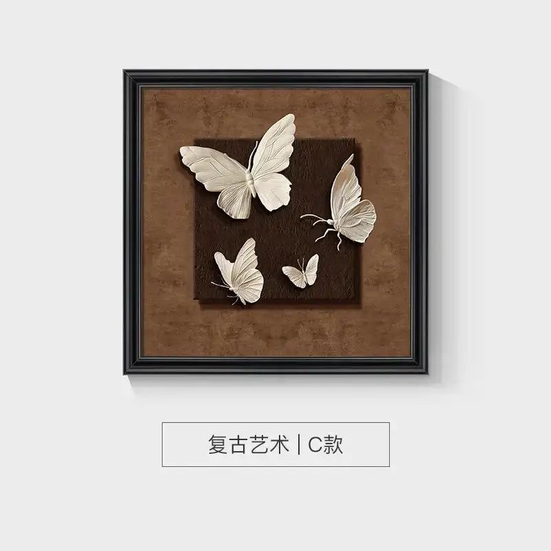 A decorbites™ animal wall decor frame set featuring three-dimensional white butterflies on a textured brown background