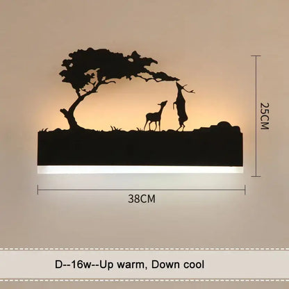 Black metal animal wall lamp featuring deer silhouette under tree illuminated with warm light for living room decor