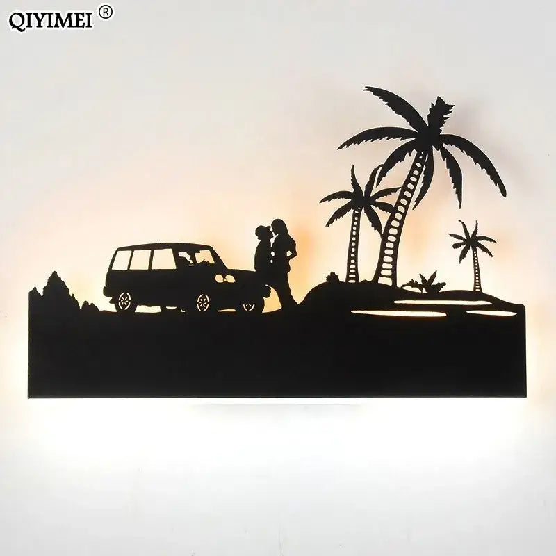 Black metal animal wall lamps by DecorBites featuring silhouette of couple kissing beside van and palm trees with warm lighting