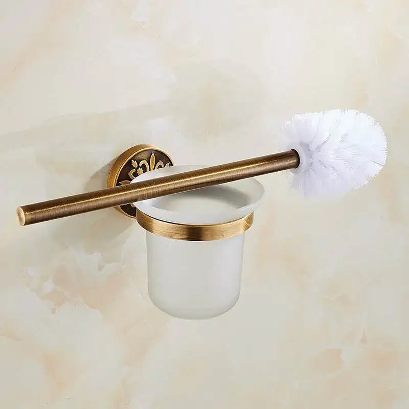 Antique brass-finished toilet brush holder with frosted glass cup and decorative wall mount in decorbites™ bath hardware set