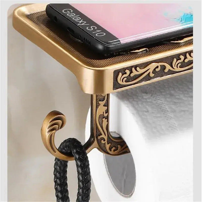 Decorbites™ antique black toilet paper holder with ornate brass scrollwork and a matching phone shelf