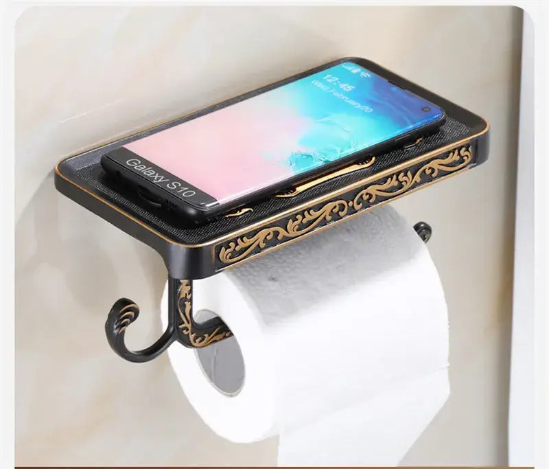 DecorBites™ antique black toilet paper holder with gold ornate design and built-in phone shelf for convenience