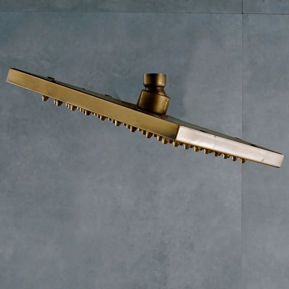 Brass-finished decorbites antique brass 8-inch square rainfall shower head with textured spiky surface and central stem