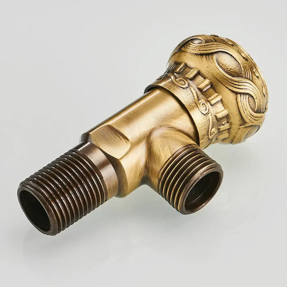 DecorBites™ antique brass angle stop valve with ornate swirling handle design for faucet and toilet use
