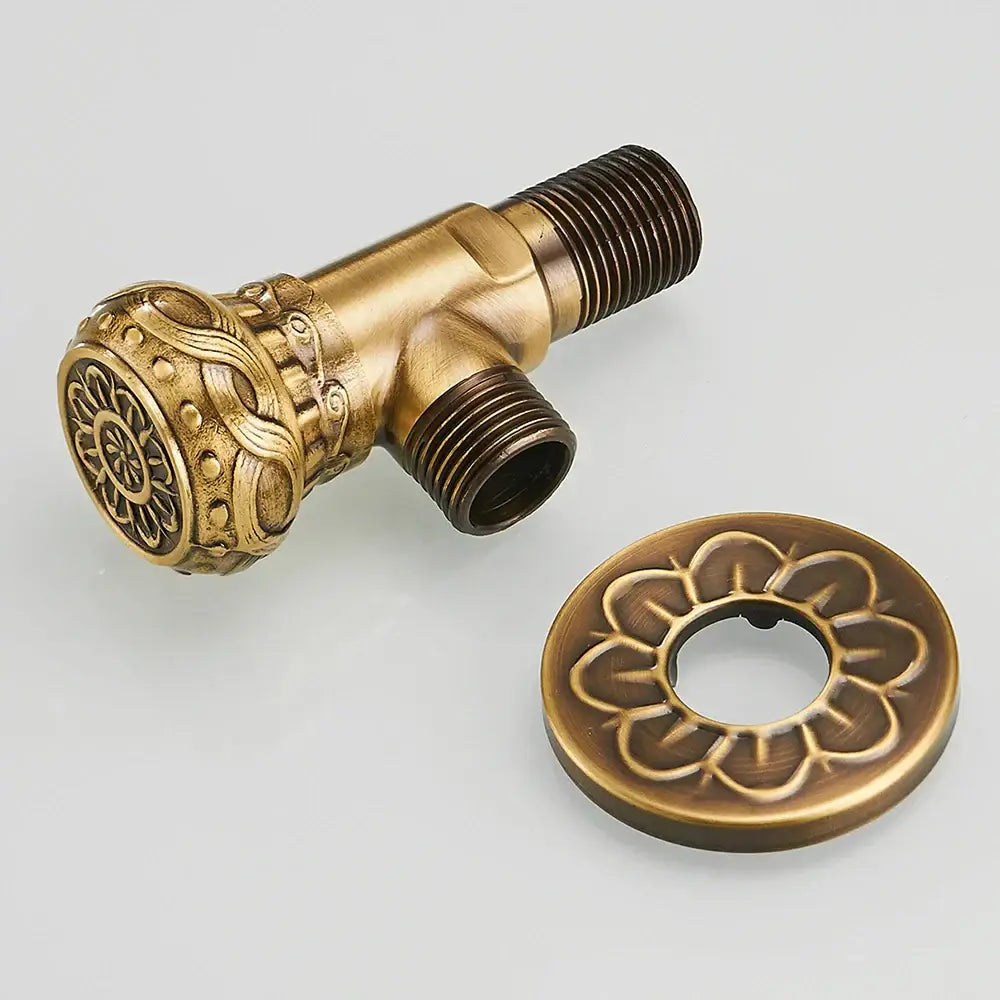 DecorBites™ antique brass angle stop valve with intricate floral embossing and matching circular flange for faucet use