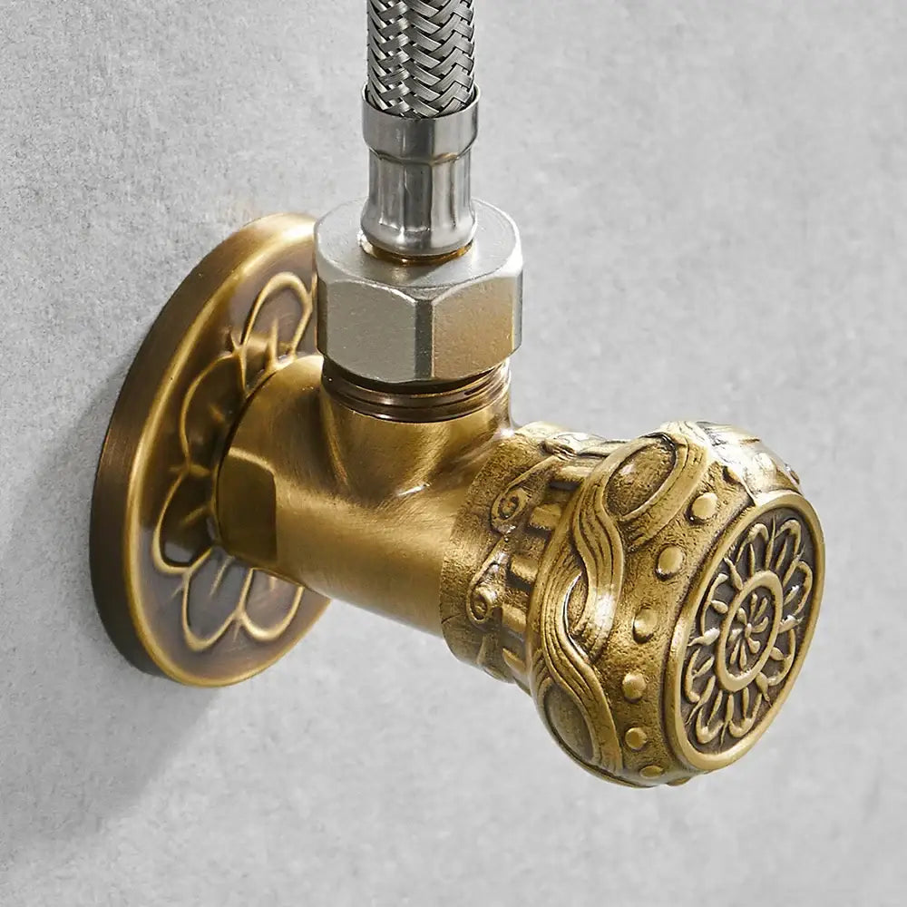 DecorBites™ antique brass angle stop valve with ornate floral and sunburst embossed detailing for faucet and toilet