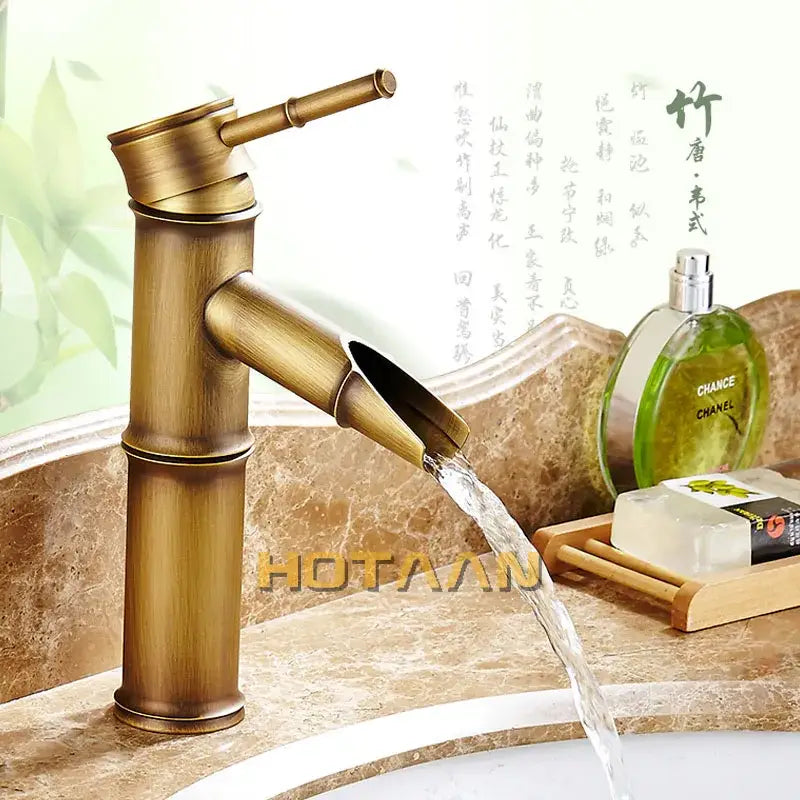 Decorbites antique brass single handle basin faucet in antique brass with bamboo style and waterfall spout design
