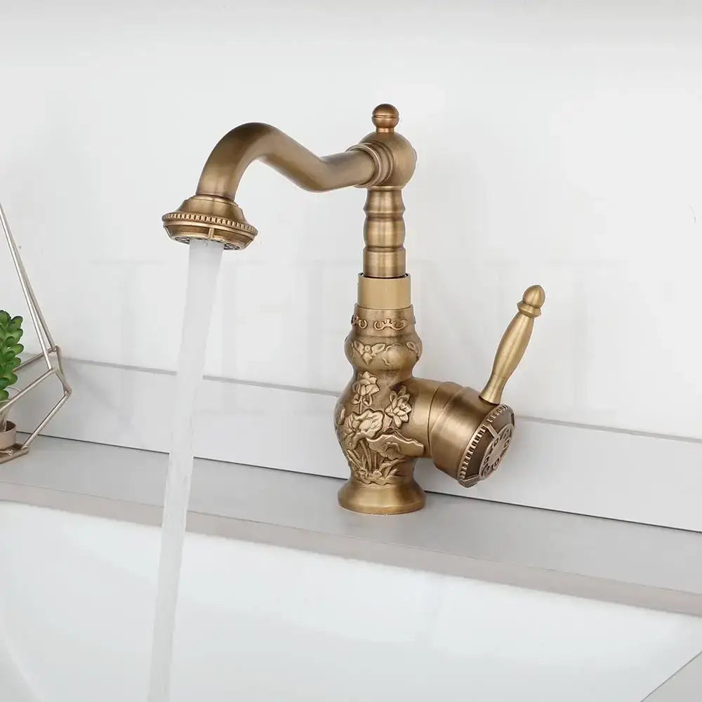 DecorBites antique brass basin faucet with ornate floral engravings and a curved spout for kitchen use