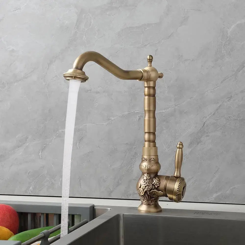 Decorbites antique brass basin faucet with ornate floral detailing and curved spout for kitchen use