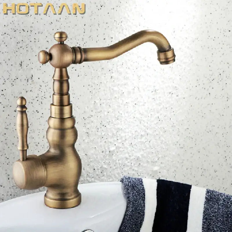 DecorBites™ antique brass basin faucet with vintage-style ornate turned spout and handle for bathroom use