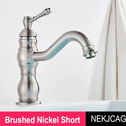Brushed nickel basin faucet with classic curved spout and ornate handle from DecorBites antique brass collection