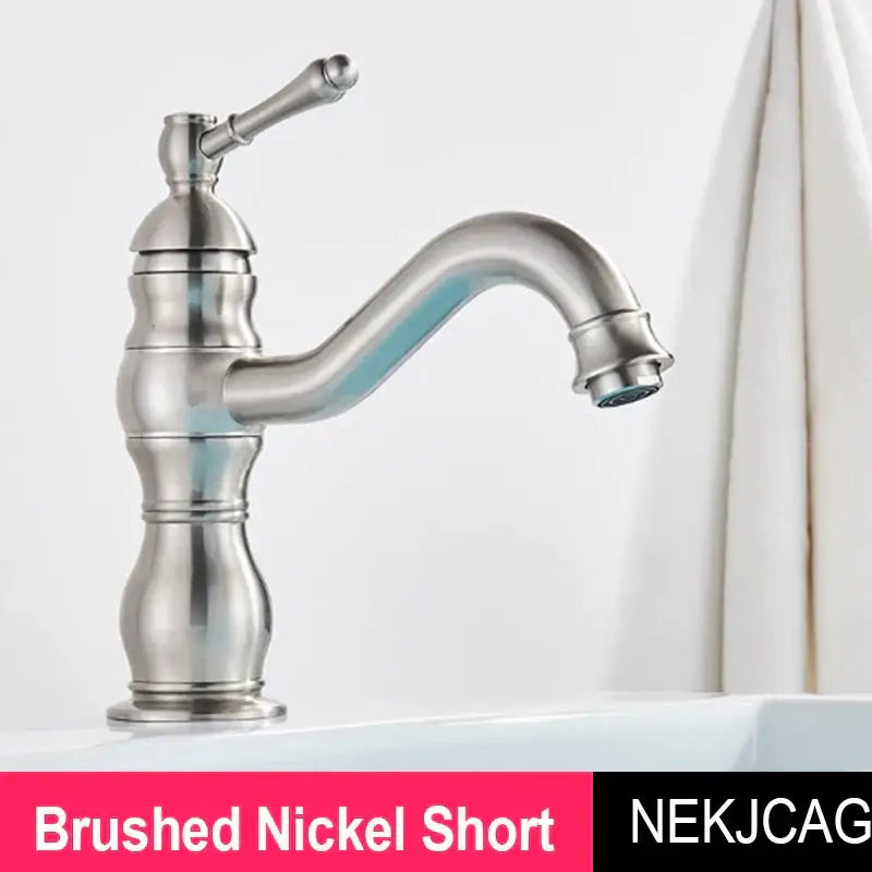 Brushed nickel basin faucet with classic curved spout and ornate handle from DecorBites antique brass collection