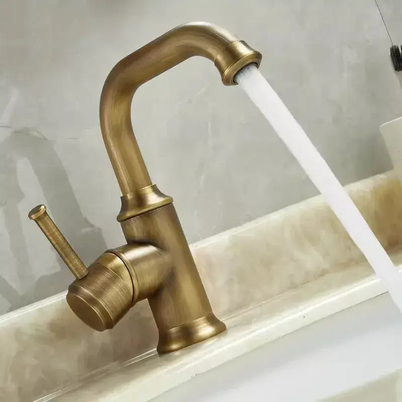 Antique brass basin faucet by decorbites featuring single handle, curved spout, and textured finish for bathroom use