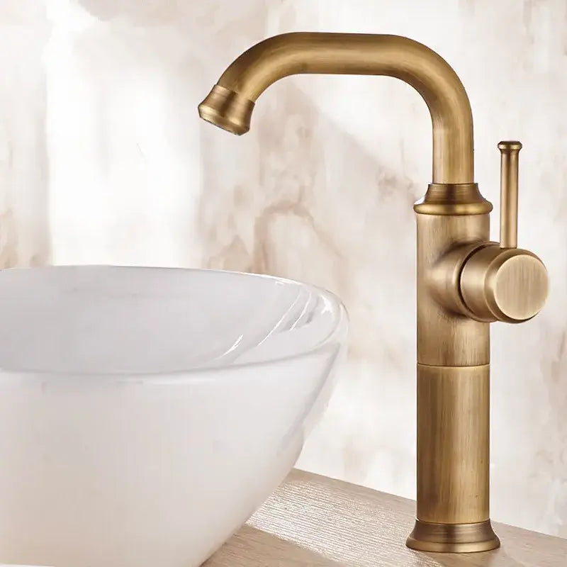 DecorBites antique brass basin faucet with single lever handle curved spout and cylindrical base for bathroom sink