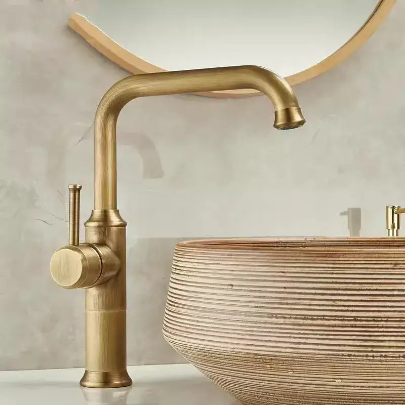 Antique brass basin faucet by DecorBites with single lever, curved spout, and cylindrical base for bathroom sink