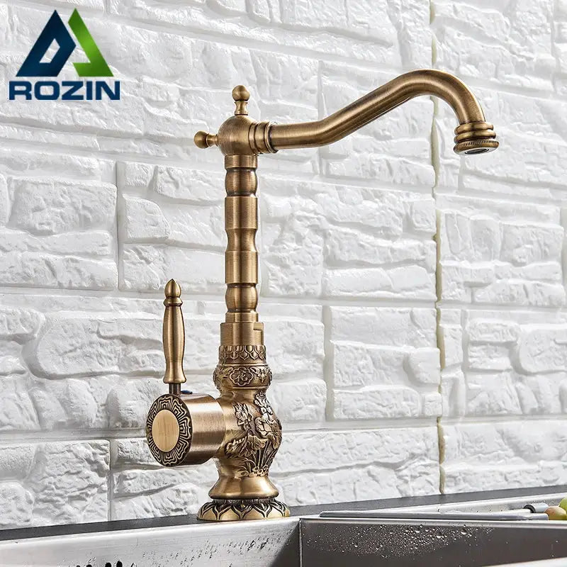 Decorbites antique brass basin faucet with ornate floral detailing and classic curved spout featuring 360 rotation