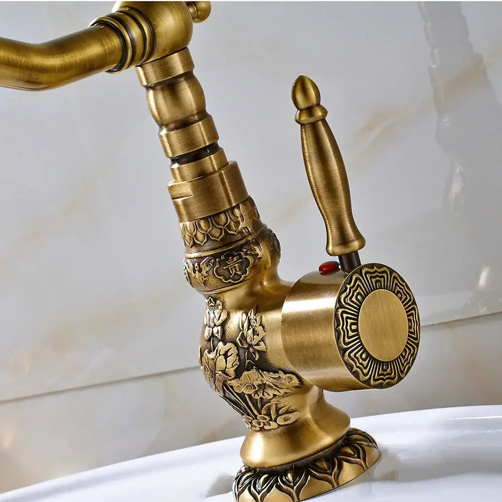 Decorbites antique brass basin faucet with long spout and intricate floral embossed design for sink use with 360 rotation