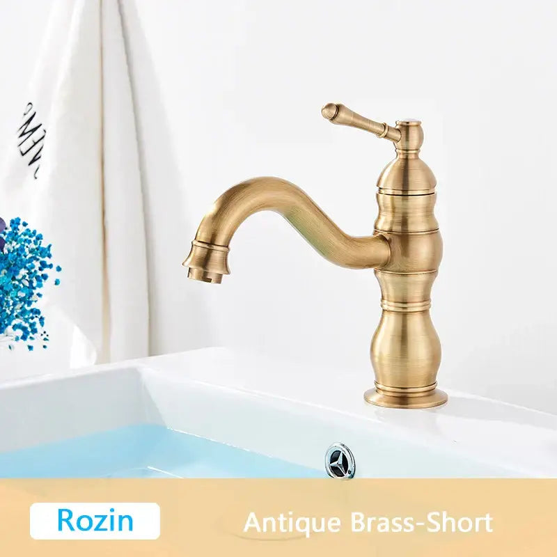 DecorBites antique brass basin faucet with a short curved spout and ornate classic design for bathroom use