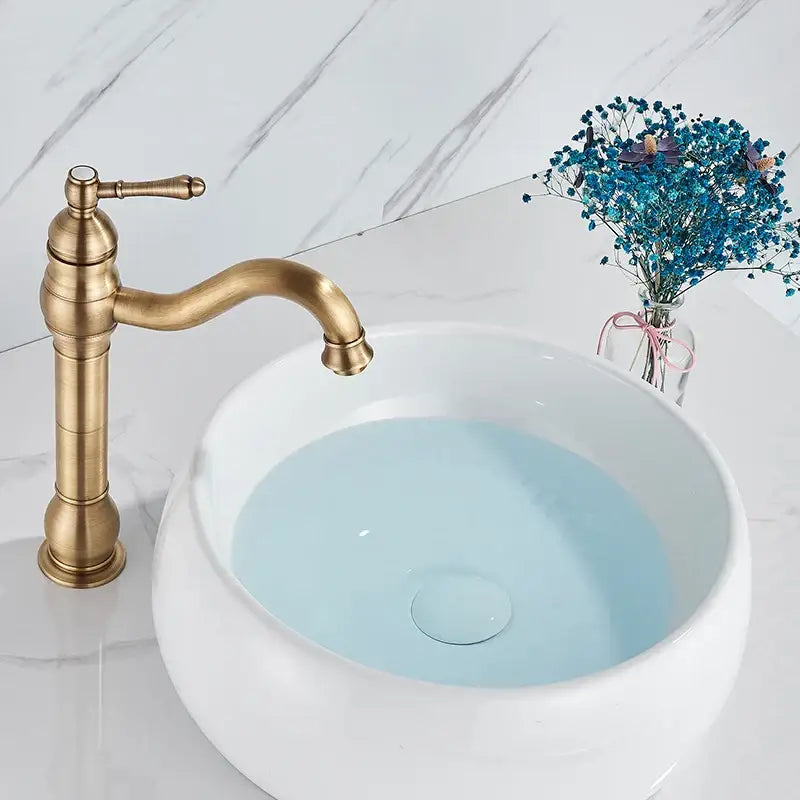 Decorbites antique brass basin faucet single handle bathroom mixer tap with curved spout and ornate detailing