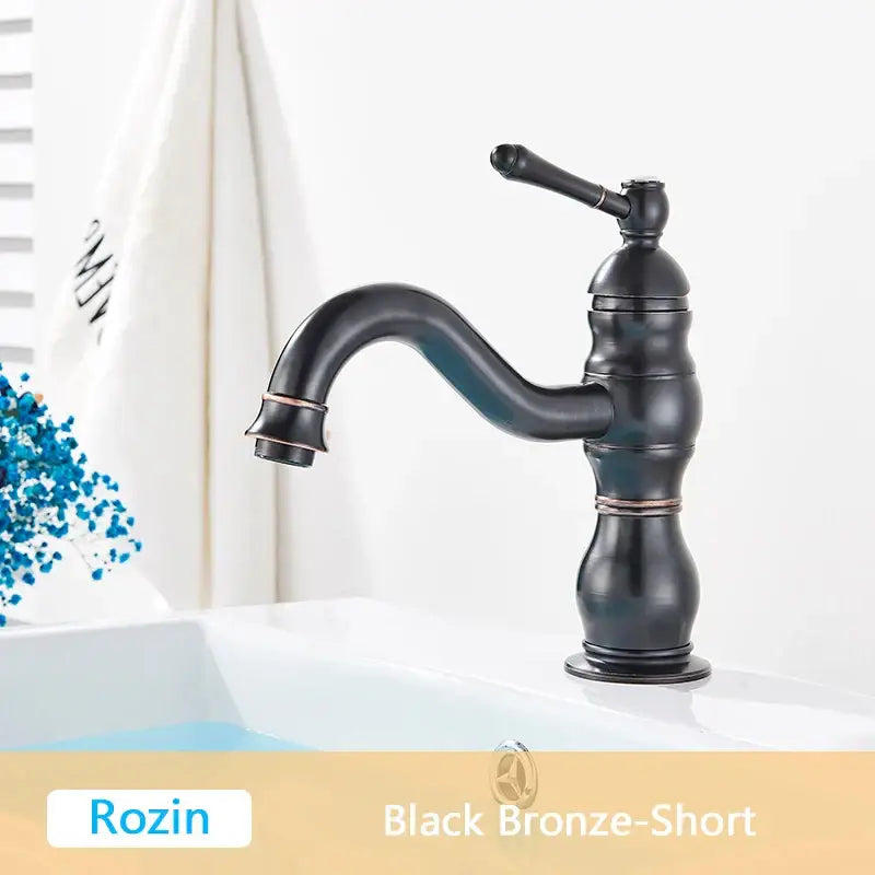 Black bronze decorbites antique brass basin faucet with curved spout and ornate segmented body for bathroom use