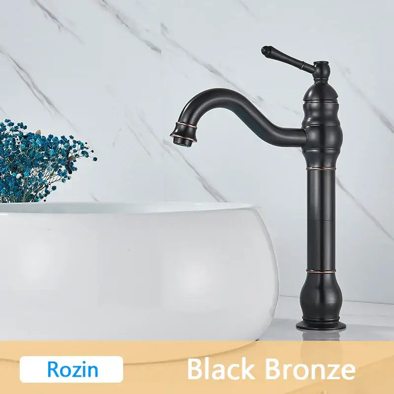 Decorbites antique brass basin faucet with black bronze finish curved spout and ornate single handle design