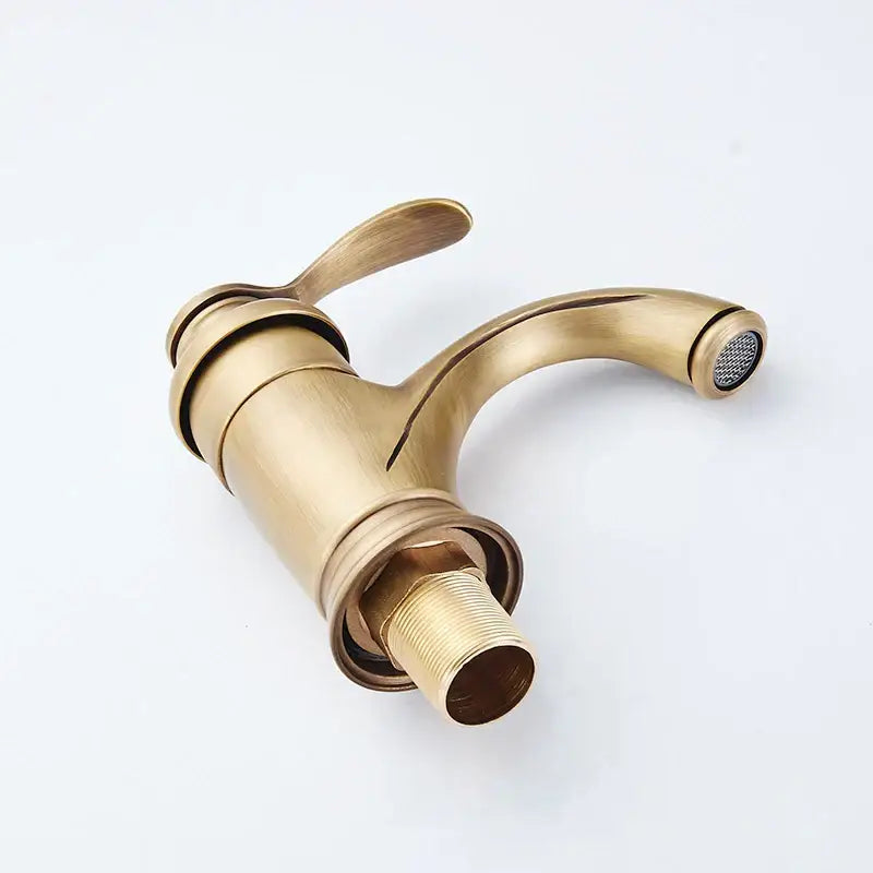 Decorbites antique brass basin faucet with single handle curved spout and integrated spray head for bathroom sink