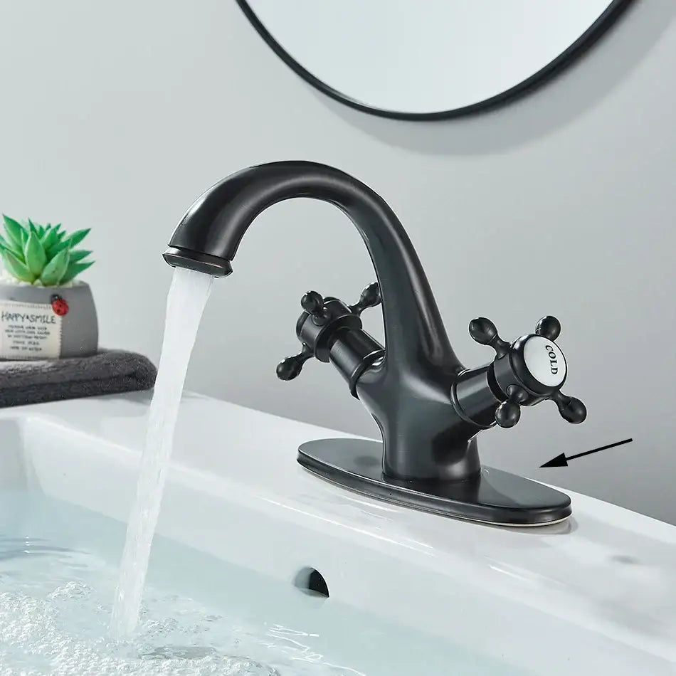 Decorbites antique brass basin faucet with black matte finish and cross-shaped handles featuring a cold label