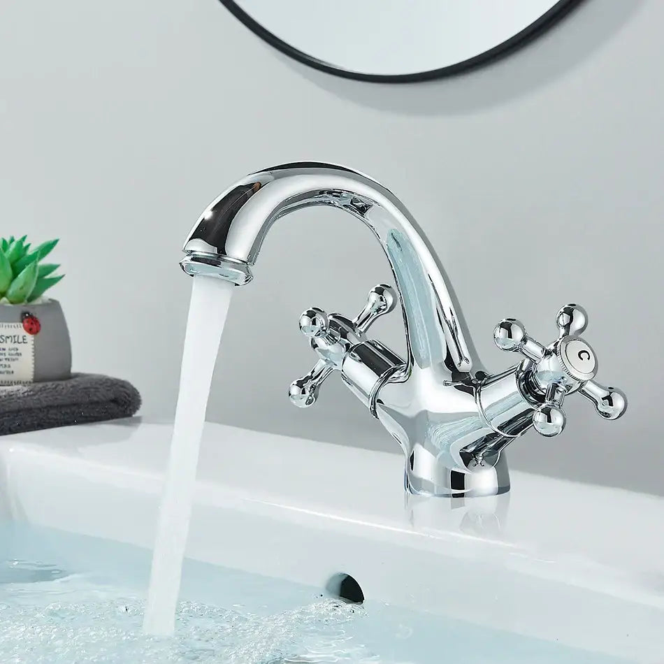 Chrome finished vintage-style basin faucet with cross handles and curved spout for decorbites antique brass basin use