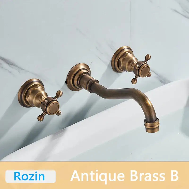 DecorBites™ antique brass basin faucet wall mounted with dual cross-handle knobs and curved swivel spout mixer tap