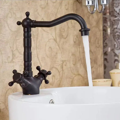 Black matte decorbites antique brass basin faucet with swivel spout and ornate cross handles in vintage style