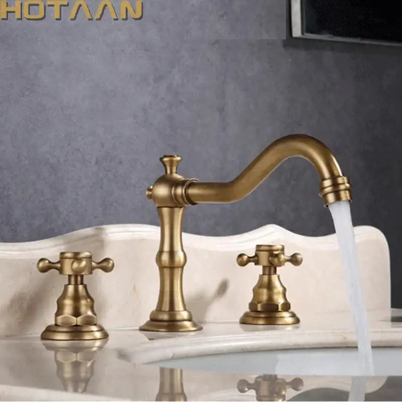 DecorBites antique brass basin mixer tap with three handles, curved spout, and cross-shaped dual handles deck mounted