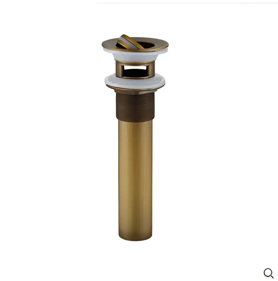 Decorbites™ antique brass basin sink drain with white rubber flange and gold-toned stopper mechanism