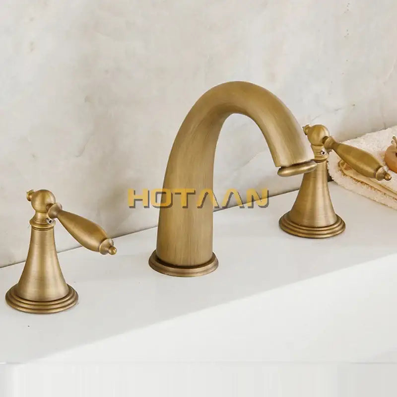 DecorBites antique brass bath mixer set with three ornate handles and curved spout in brass finish