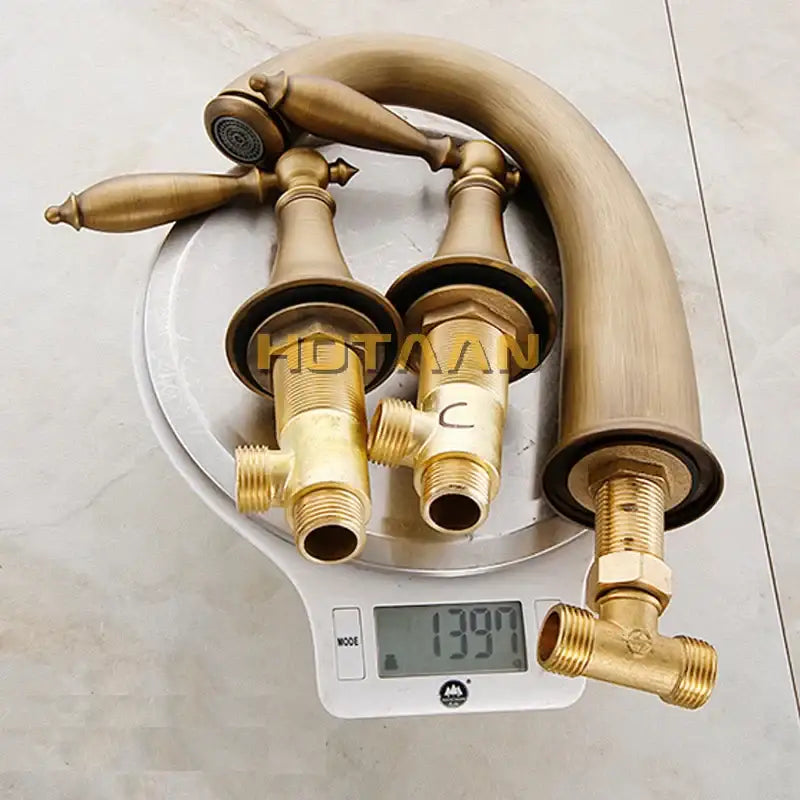 Decorbites™ antique brass bath mixer set with elegant curved spout and ornate handles in brass finish for bathroom use