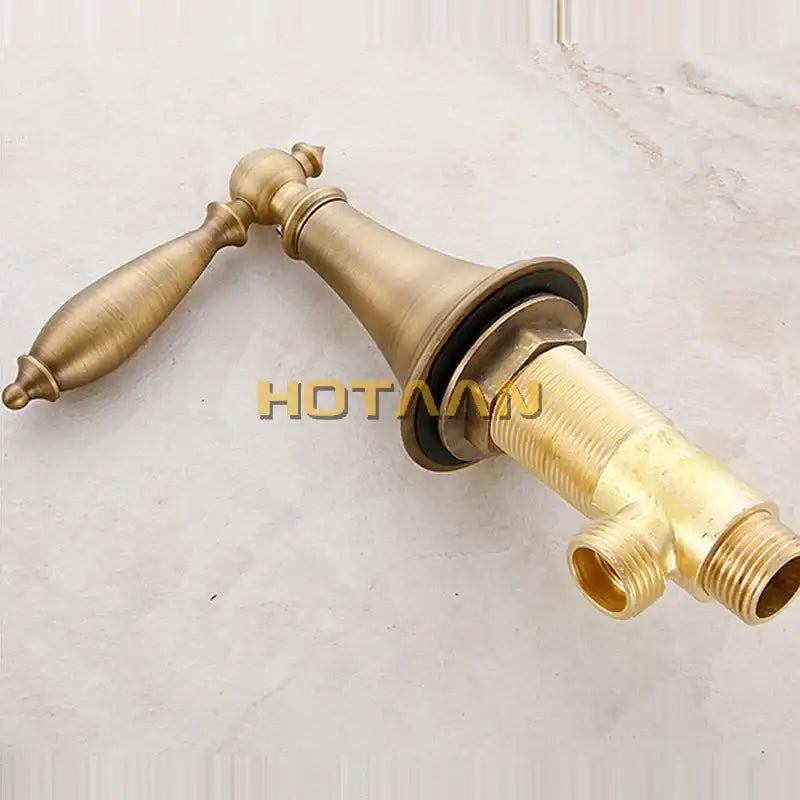 Decorbites antique brass bath mixer set with hand shower featuring a single-handle brass-finished bath mixer with ornate design