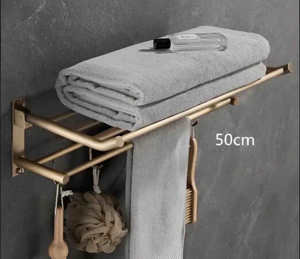 A sleek 50cm bronze finished towel rack from decorbites antique brass bathroom accessory set holding gray towels