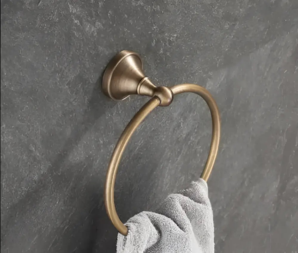 Antique brass bathroom towel ring with sleek circular design and polished finish from DecorBites brass accessory set