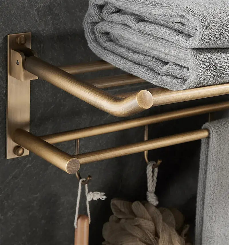 DecorBites™ antique brass bathroom accessory set featuring a brass-finished wall-mounted towel rack with three bars