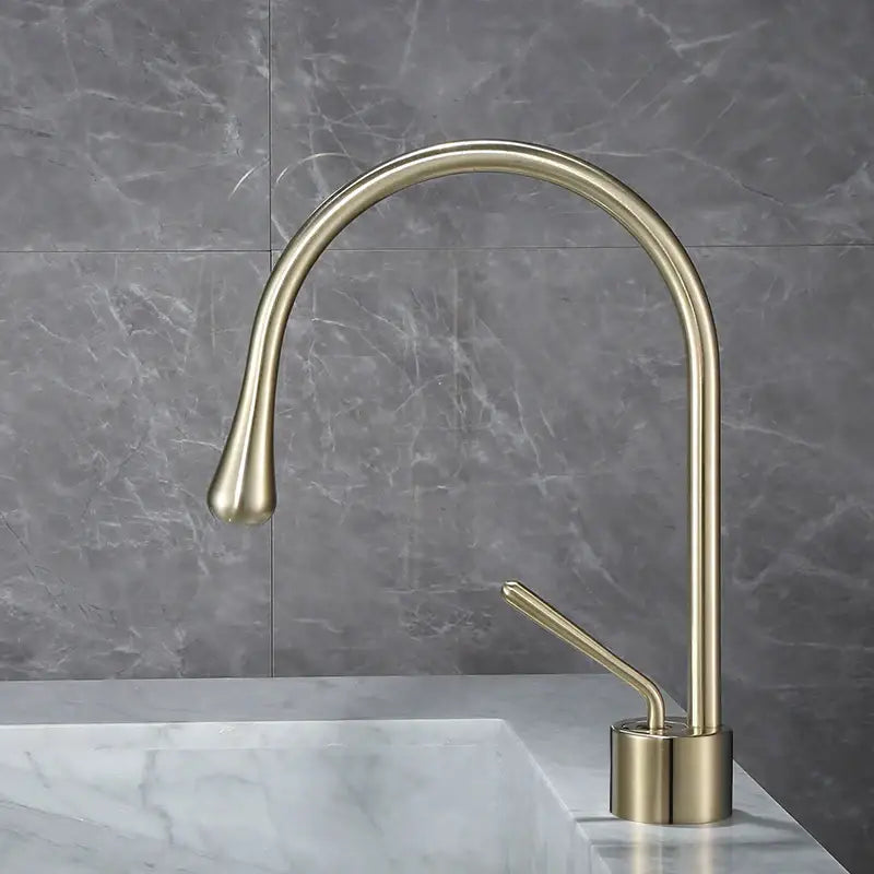 Modern brass bathroom basin faucet with antique brass finish sleek curved spout for hot cold water mixing