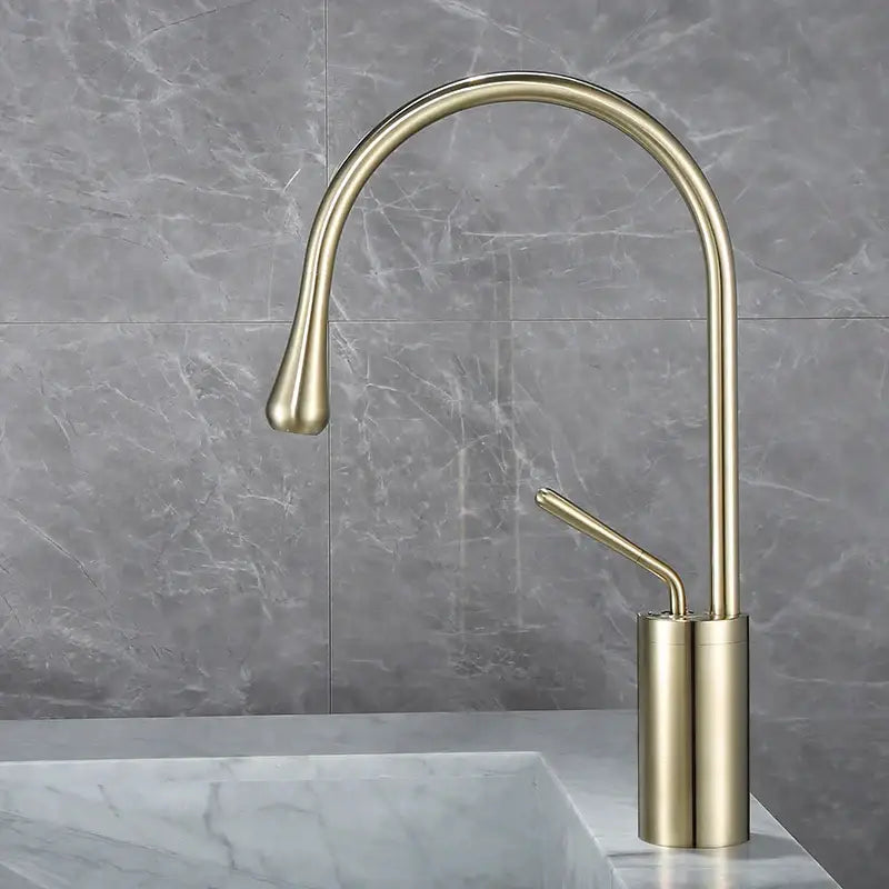 Decorbites™ brass bathroom basin faucet with antique brass finish and sleek curved spout for modern kitchen use