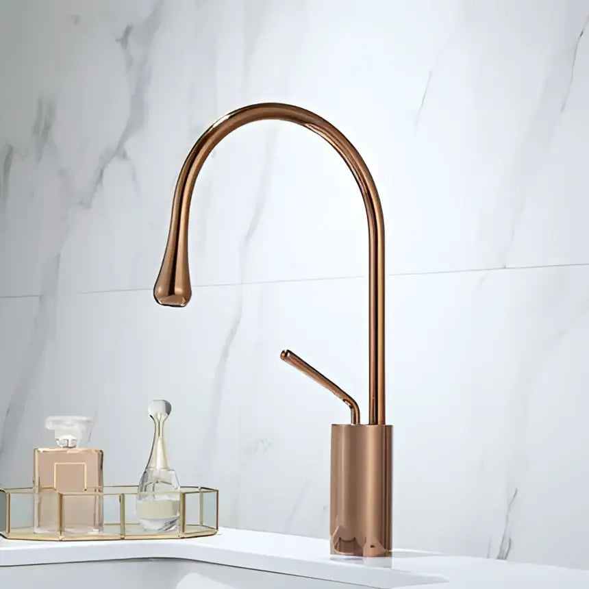 Decorbites™ antique brass bathroom basin faucet with copper finish sleek curved spout and cylindrical base