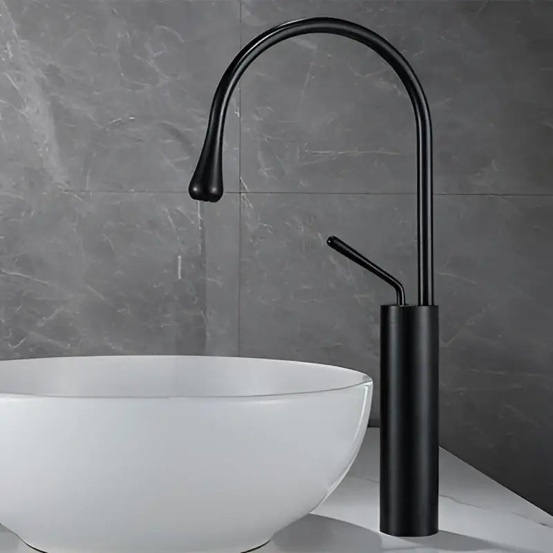 Black matte finish basin faucet with curved spout and cylindrical base for antique brass bathroom or kitchen use