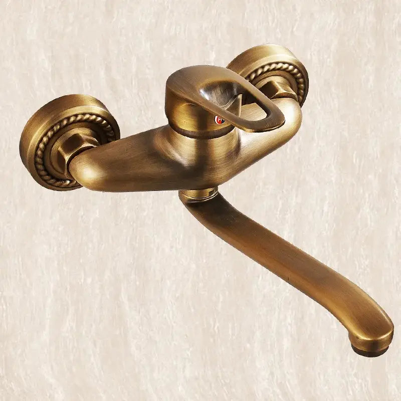 Decorbites antique brass bathroom basin faucet with ornate rope-textured handles and a long curved wall mount spout