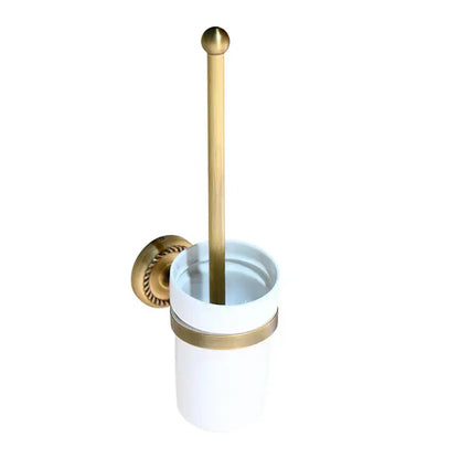 White ceramic toilet brush holder with gold-toned accents and brass handle from decorbites antique brass bathroom hardware set