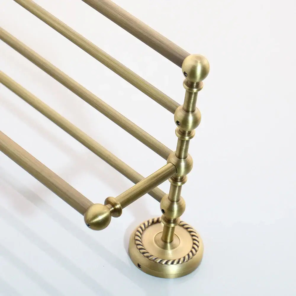 Brass-finished four-tiered towel rack with ornate finials and rope-twist base from decorbites antique brass bathroom hardware set