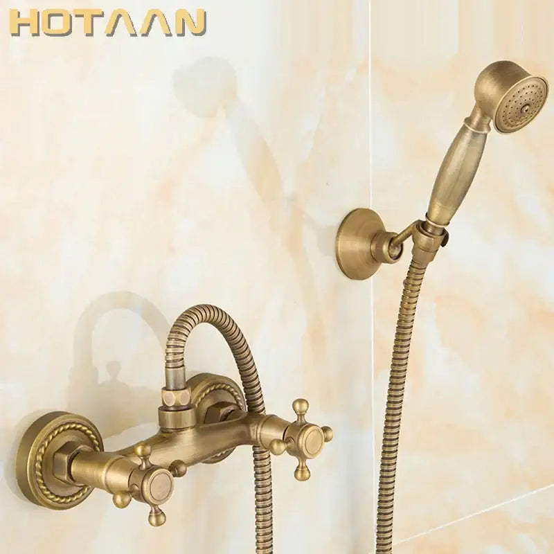 Decorbites™ antique brass bathroom shower and basin tap set with ornate detailing and matching handheld showerhead